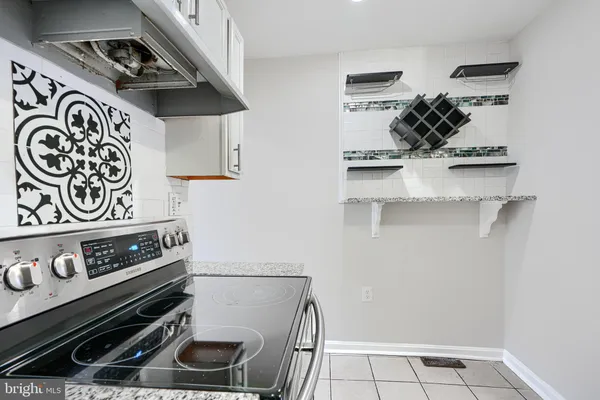 a kitchen with a stove and a microwave