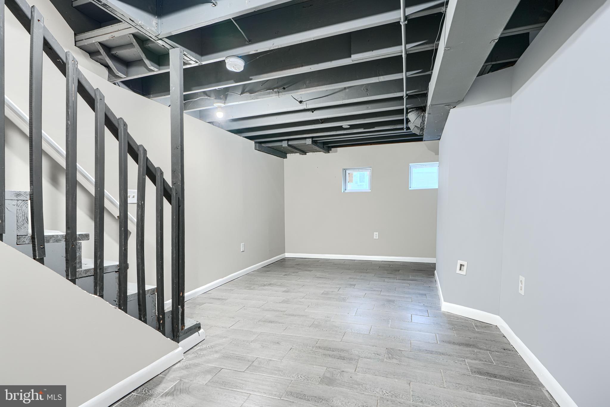 1127 Sargeant Street Baltimore, MD 21223 - Photo 26 of 30 a view of an empty room with wooden floor