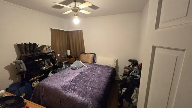 a bed room with a bed and a chandelier