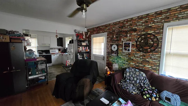 a living room with furniture and a window