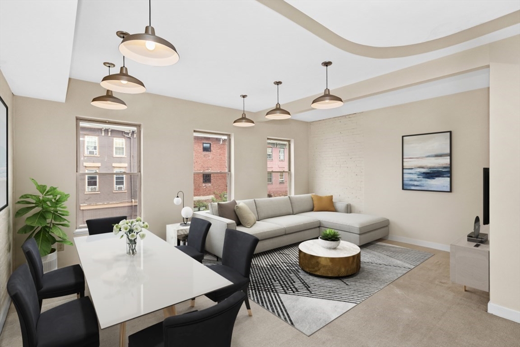 296 Meridian Street, Unit 2 Boston, MA 02128 - Photo 1 of 11 a living room with furniture potted plant and a chandelier