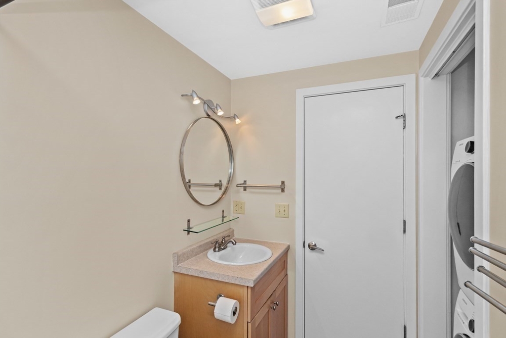 296 Meridian Street, Unit 2 Boston, MA 02128 - Photo 9 of 11 a bathroom with a sink and a mirror