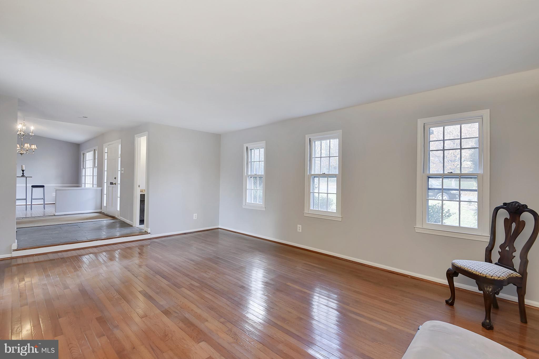Living Room Open to Foyer and Dining Room