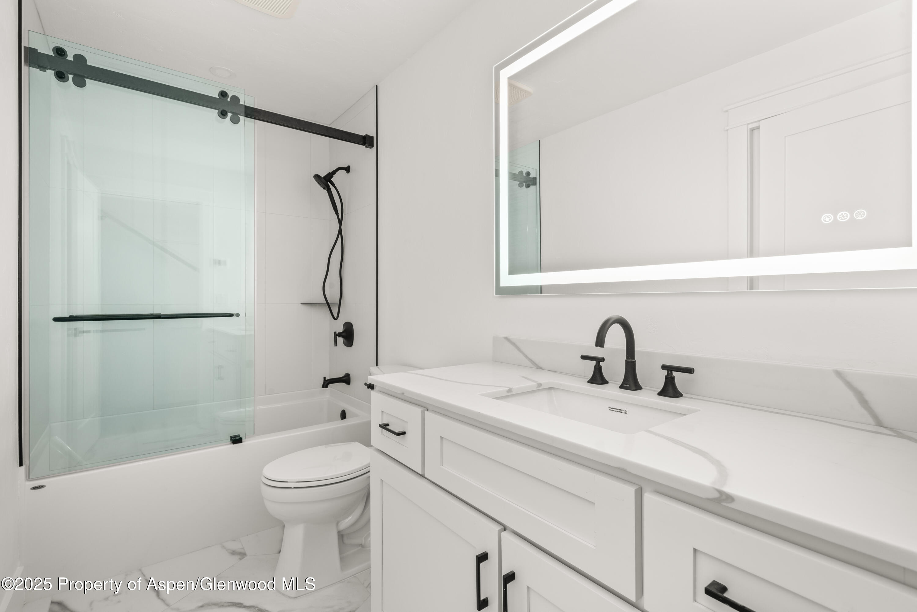 479 Redstone Boulevard Redstone, CO 81623 - Photo 17 of 26 a bathroom with a sink toilet and shower