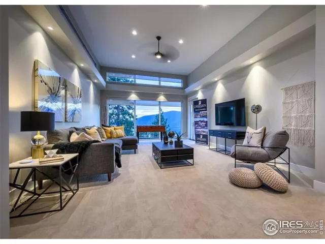 a kitchen with stainless steel appliances granite countertop a refrigerator a oven a sink and white cabinets with wooden floor