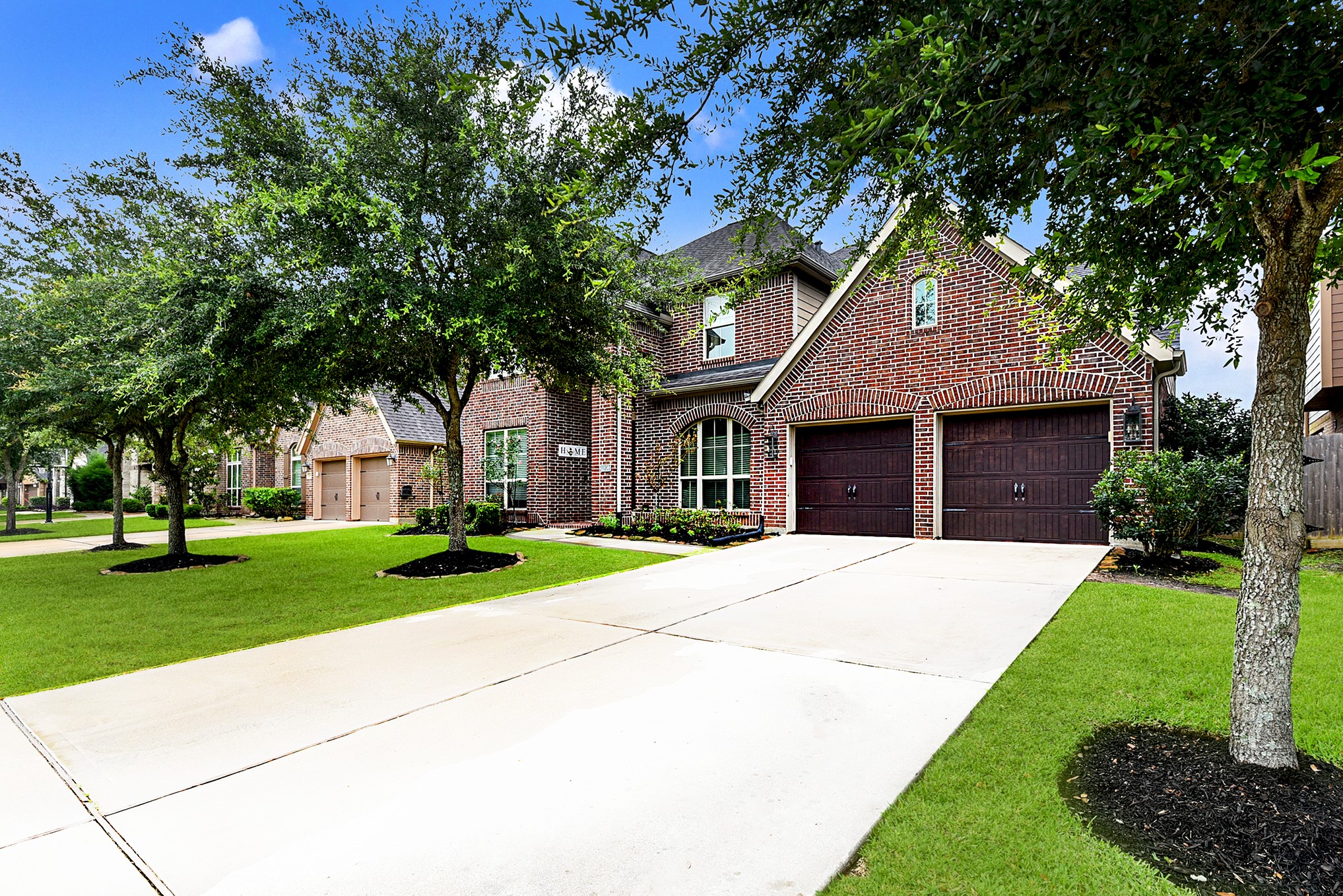 2939 Bobby Jones Road Katy, TX 77494 - Photo 2 of 50 a front view of a house with a yard and garage