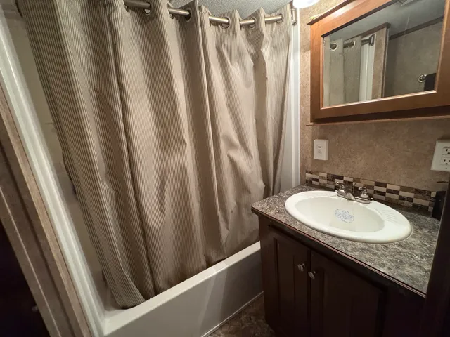 a bathroom with a sink and a mirror