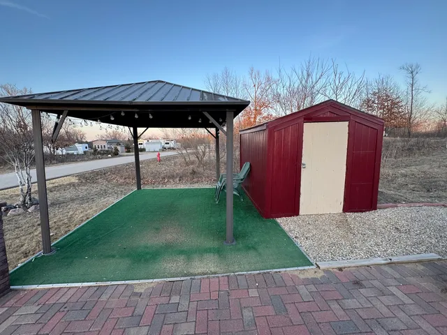 a view of a backyard with a tub
