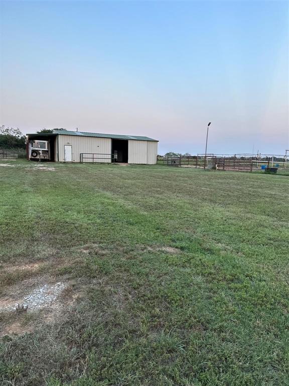 2901 Wind Mill Court Tolar, TX 76476 - Photo 25 of 38 a view of a terrace with a garden
