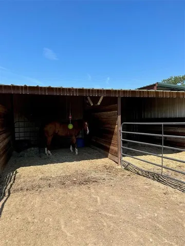 a view of a lake with houses in the back