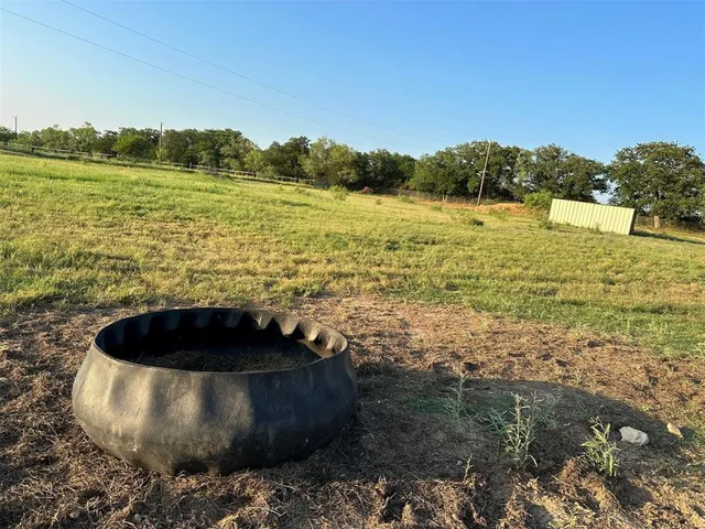 a view of a field with an ocean