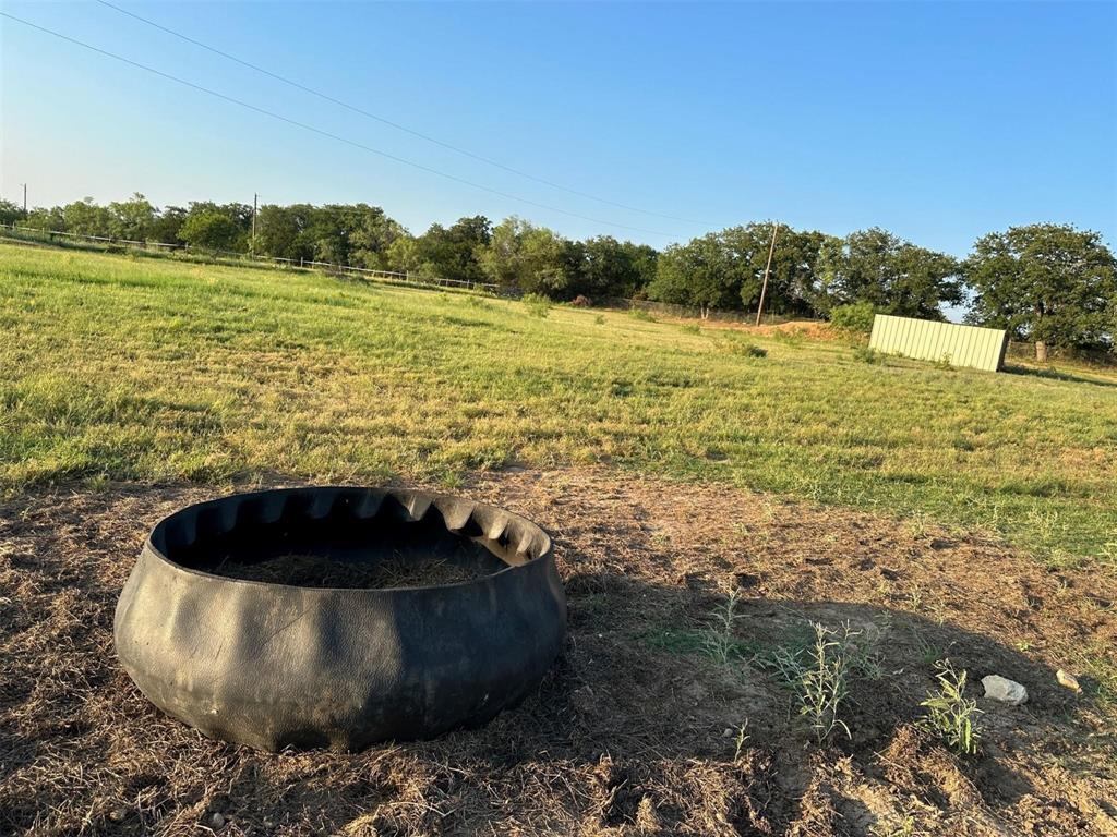 2901 Wind Mill Court Tolar, TX 76476 - Photo 34 of 38 a view of a lake from a yard