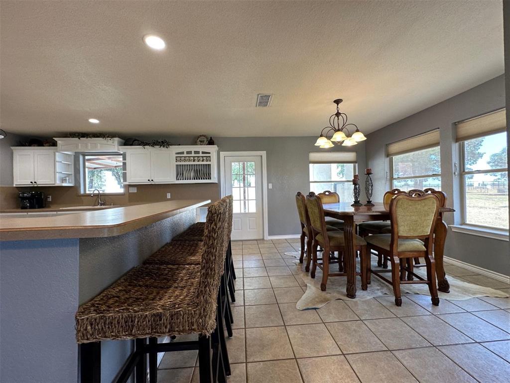 2901 Wind Mill Court Tolar, TX 76476 - Photo 7 of 38 a dining room with furniture and window