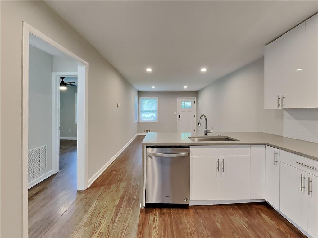 224 Buchanan Terrace Decatur, GA 30030 - Photo 14 of 23 a kitchen with granite countertop a sink and cabinets