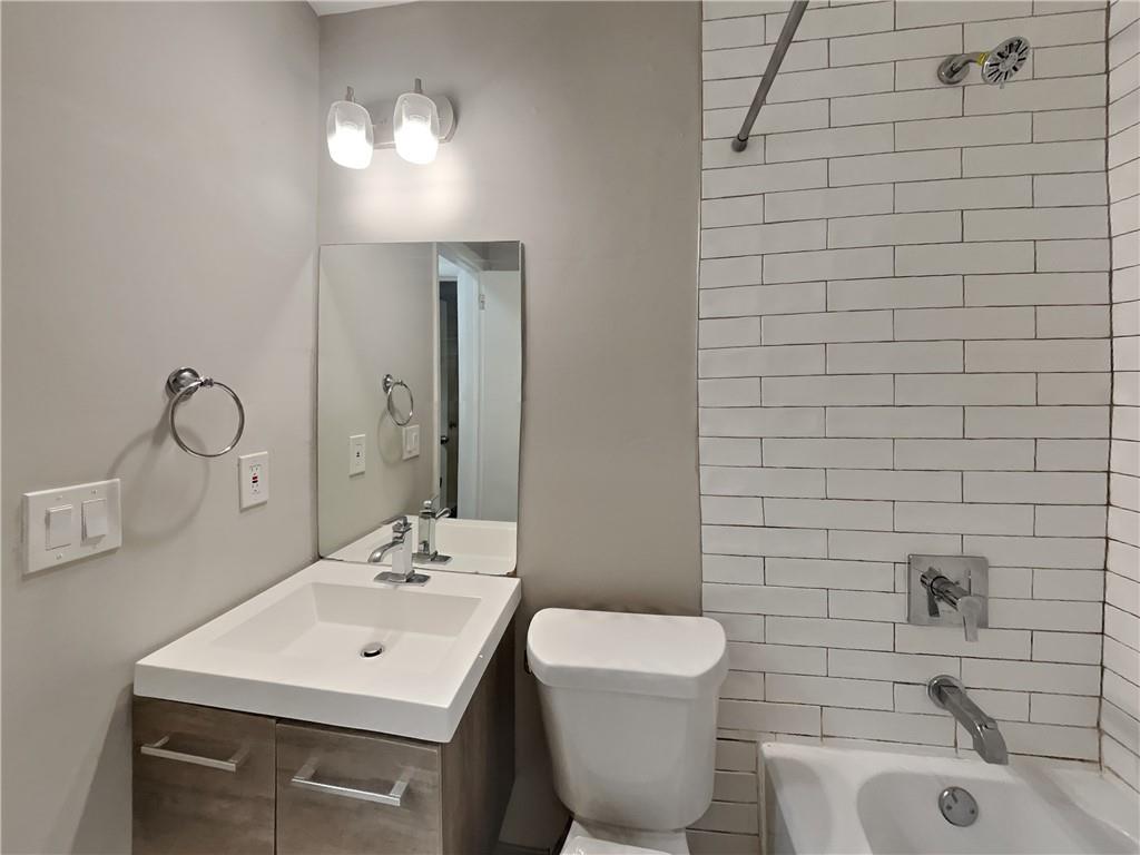 224 Buchanan Terrace Decatur, GA 30030 - Photo 8 of 23 a bathroom with a sink a toilet and shower