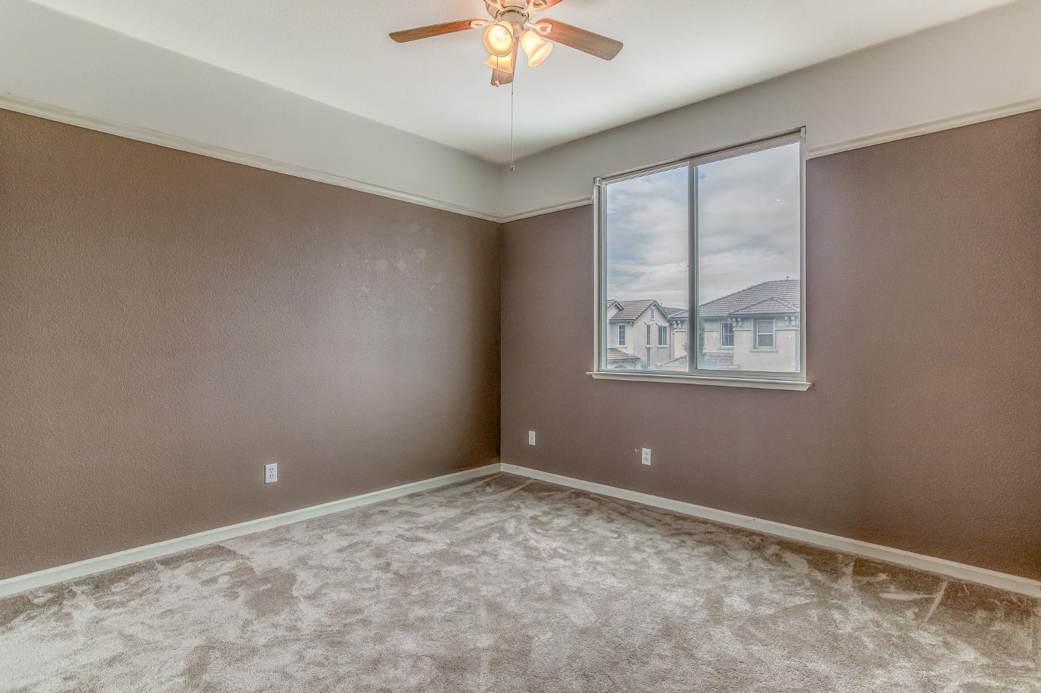 188 Thomsen Road Lathrop, CA 95330 - Photo 18 of 27 a view of an empty room with a window