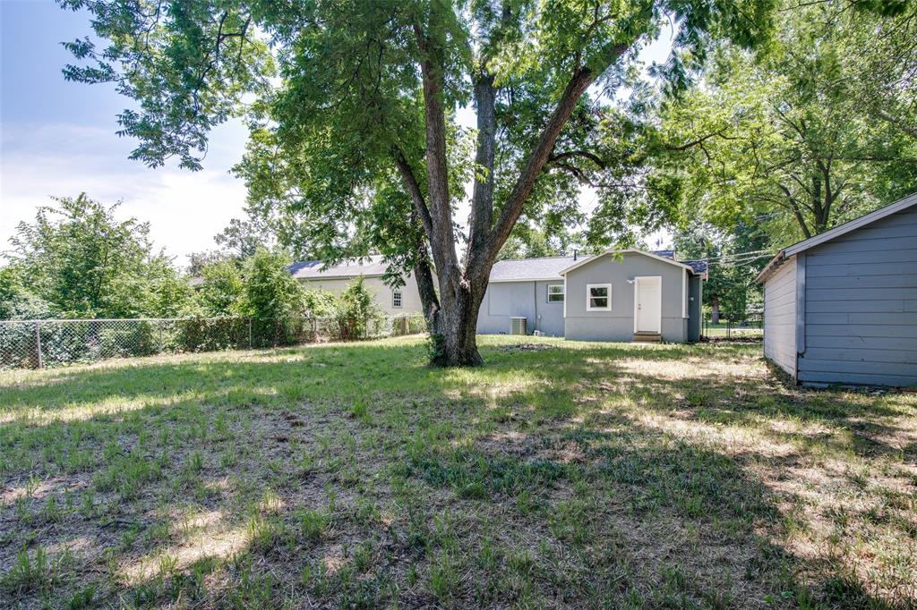606 West High Street Terrell, TX 75160 - Photo 27 of 28 a view of a house with backyard