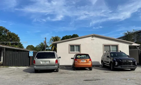 a car parked in front of a house