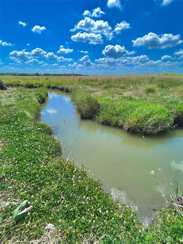 a view of a lake with a big yard