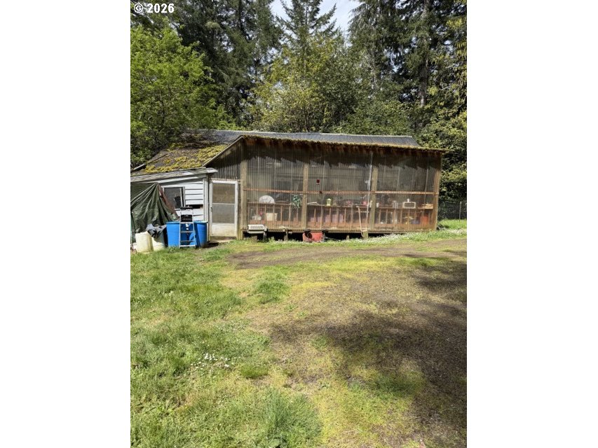1499 Carlson Road Reedsport, OR 97467 - Photo 15 of 16 a view of a house with a yard