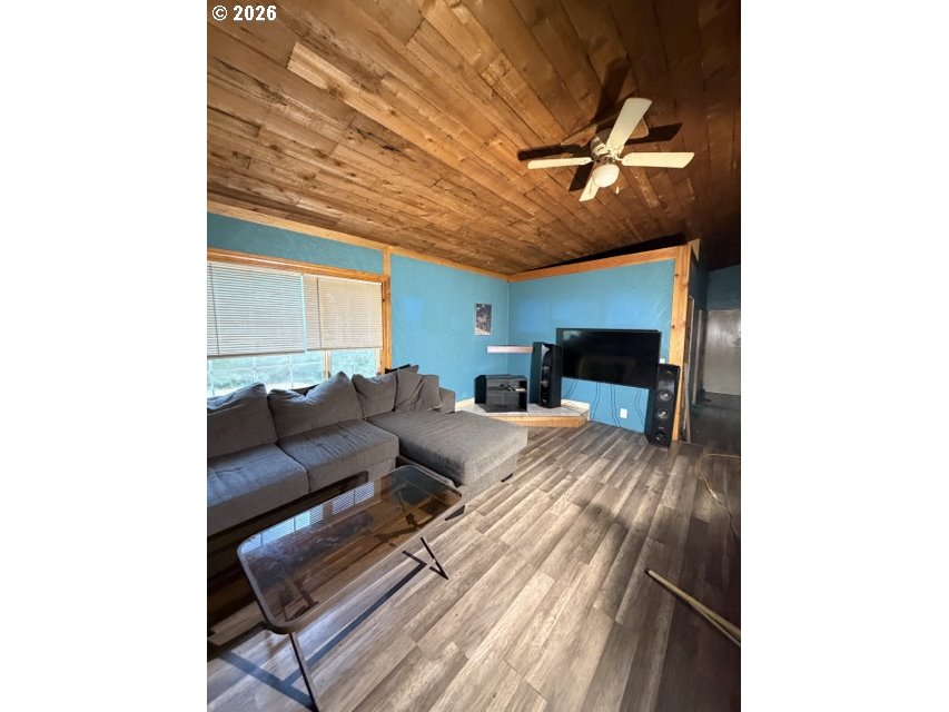 1499 Carlson Road Reedsport, OR 97467 - Photo 5 of 16 a living room with furniture and a fireplace