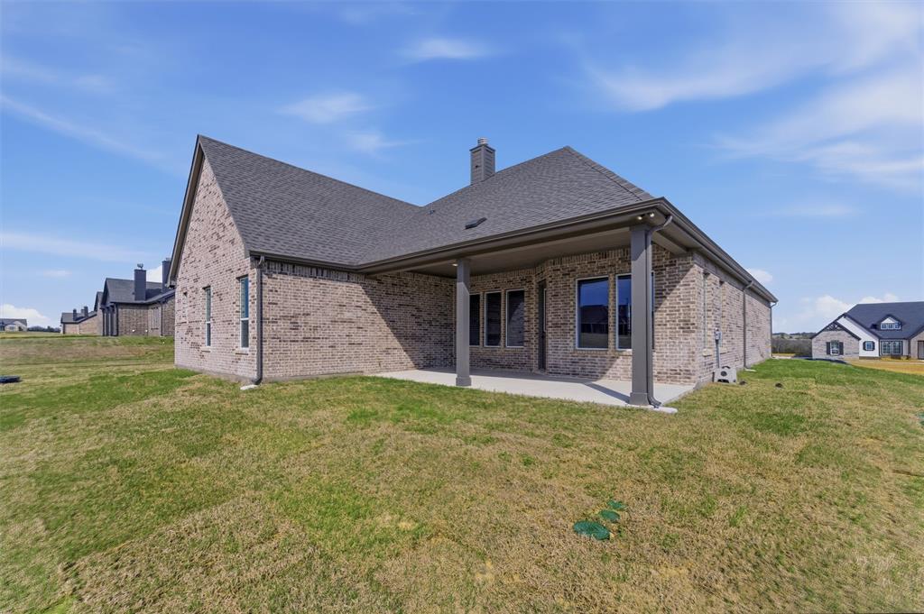 814 Vly Rdg Road Van Alstyne, TX 75495 - Photo 20 of 24 a front view of a house with a yard