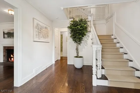 a view of entryway with paintings on the wall