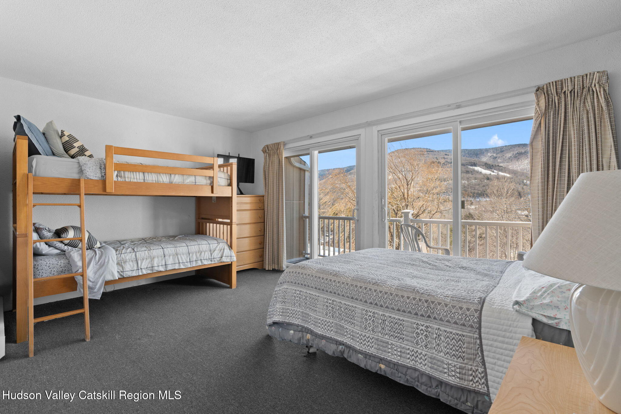 55 Scribner Hollow Road, Unit B4 Hunter, NY 12442 - Photo 14 of 39 a bedroom with a bed and a window