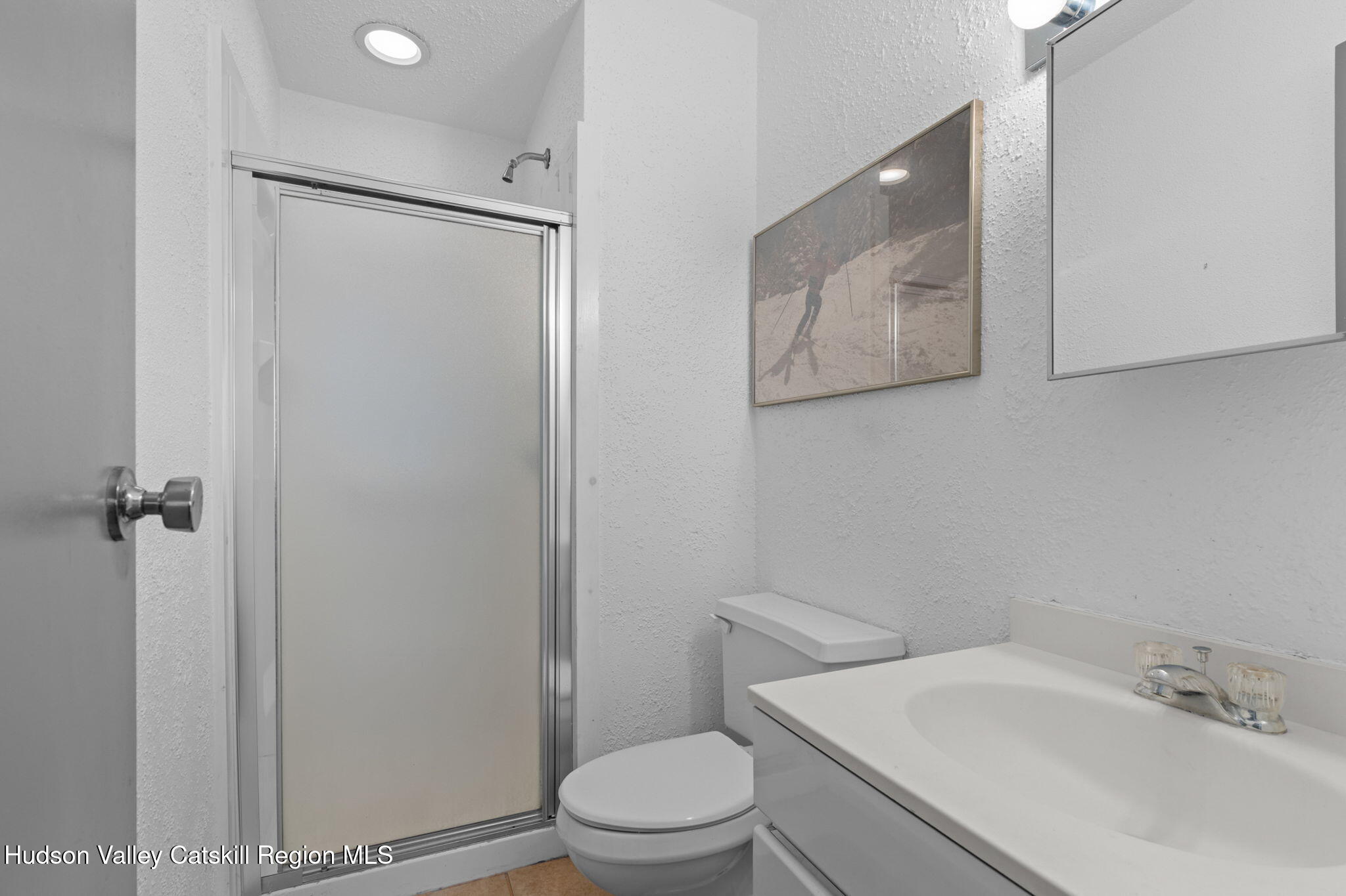 55 Scribner Hollow Road, Unit B4 Hunter, NY 12442 - Photo 22 of 39 a white toilet sitting next to a bathroom sink