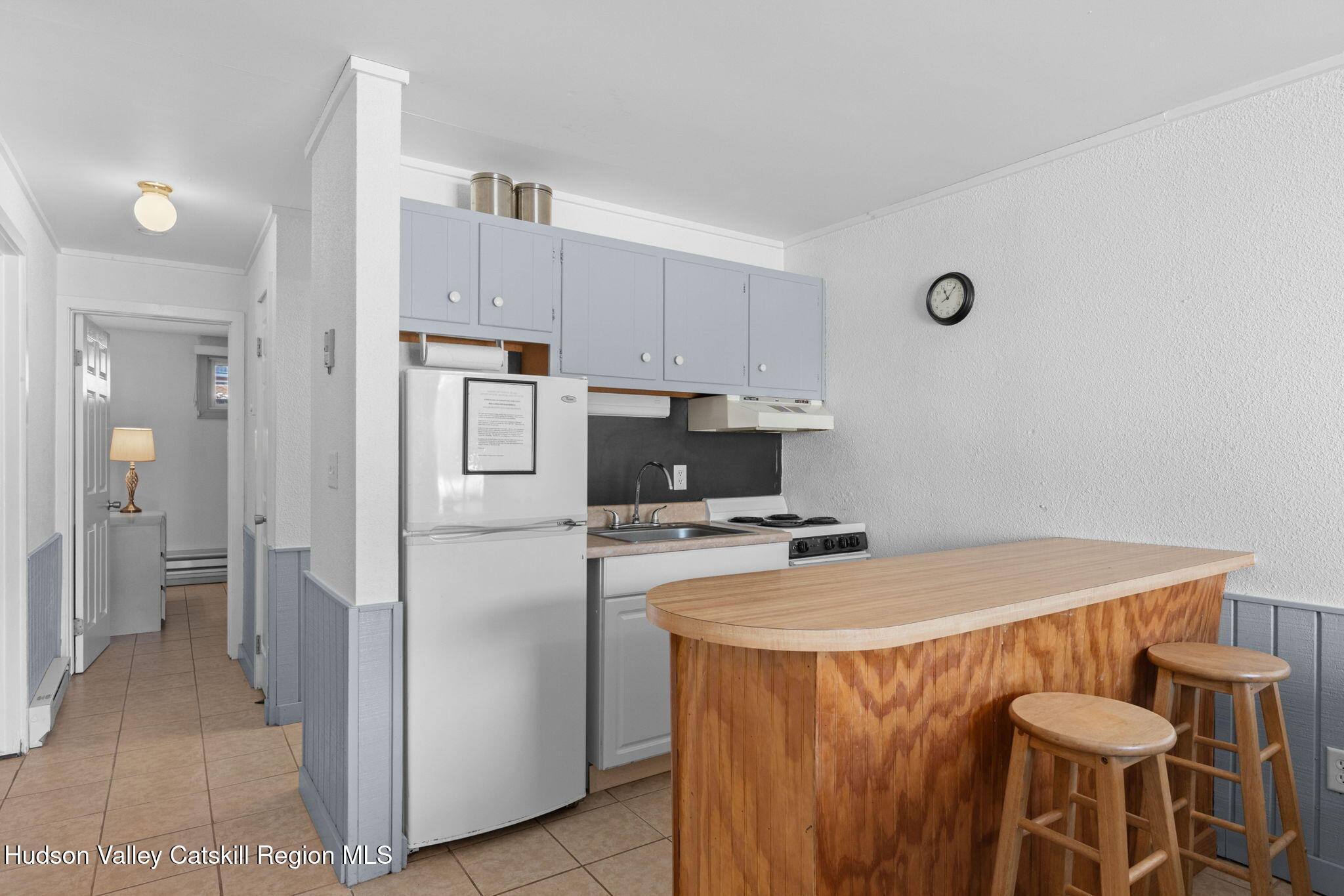55 Scribner Hollow Road, Unit B4 Hunter, NY 12442 - Photo 27 of 39 a kitchen with stainless steel appliances a stove a refrigerator and a refrigerator
