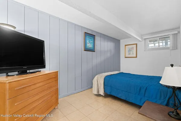 a bedroom with a bed and couch