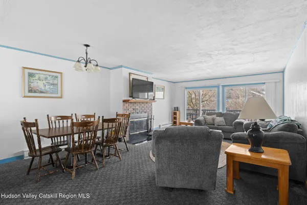 a view of a livingroom with furniture and window