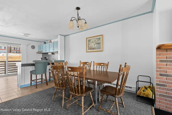 a view of a dining room with furniture and window