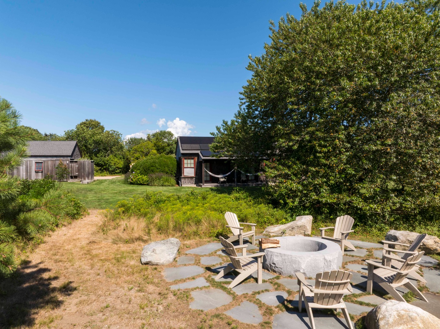 65 Carl's Way West Tisbury, MA 02568 - Photo 24 of 25 a view of a chairs and table in the garden