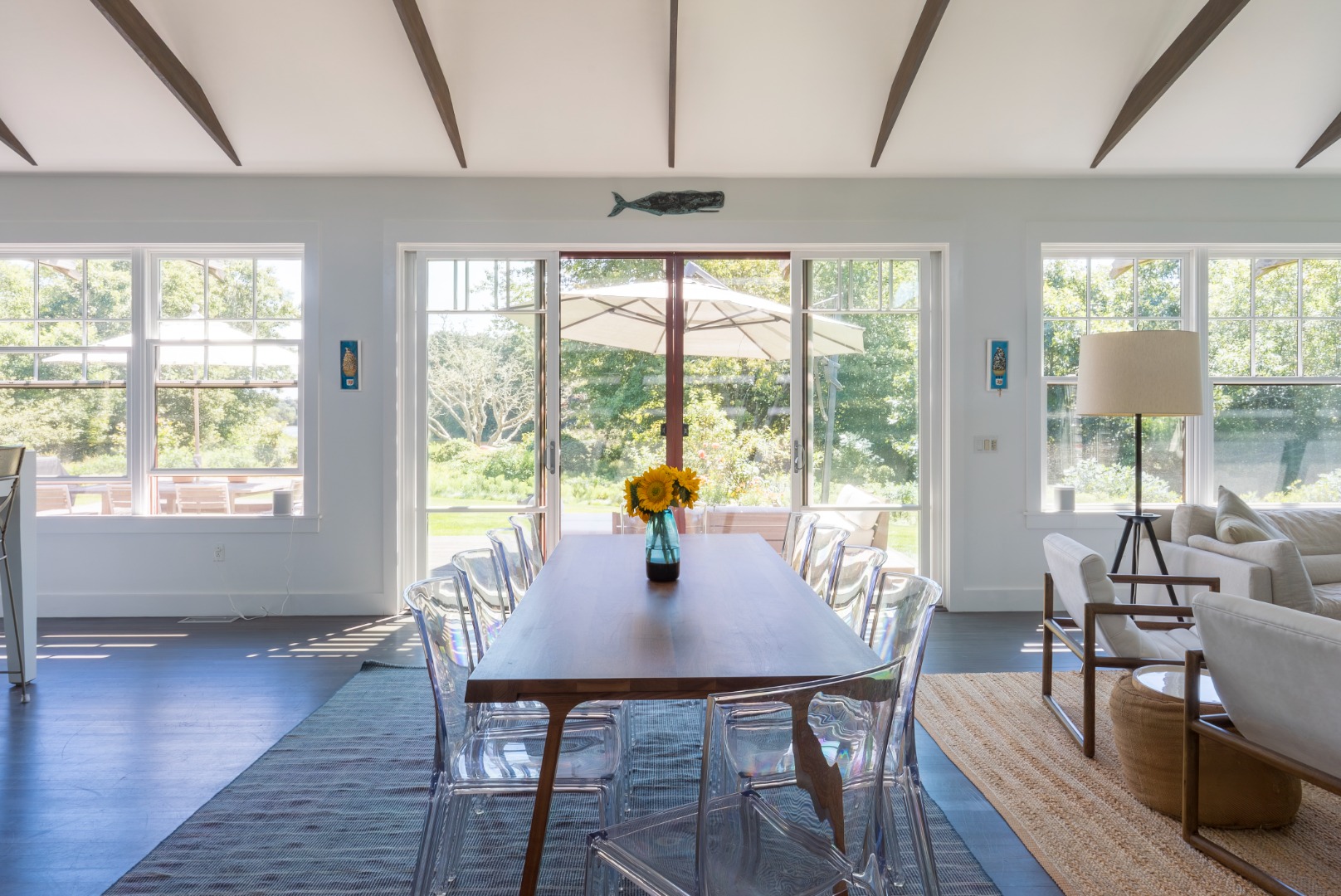 65 Carl's Way West Tisbury, MA 02568 - Photo 9 of 25 a dining room with wooden floor and large windows