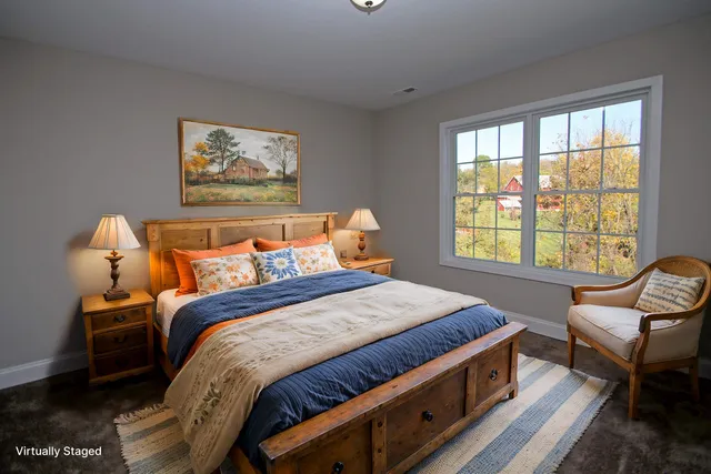 a bathroom with a double vanity sink toilet and a mirror