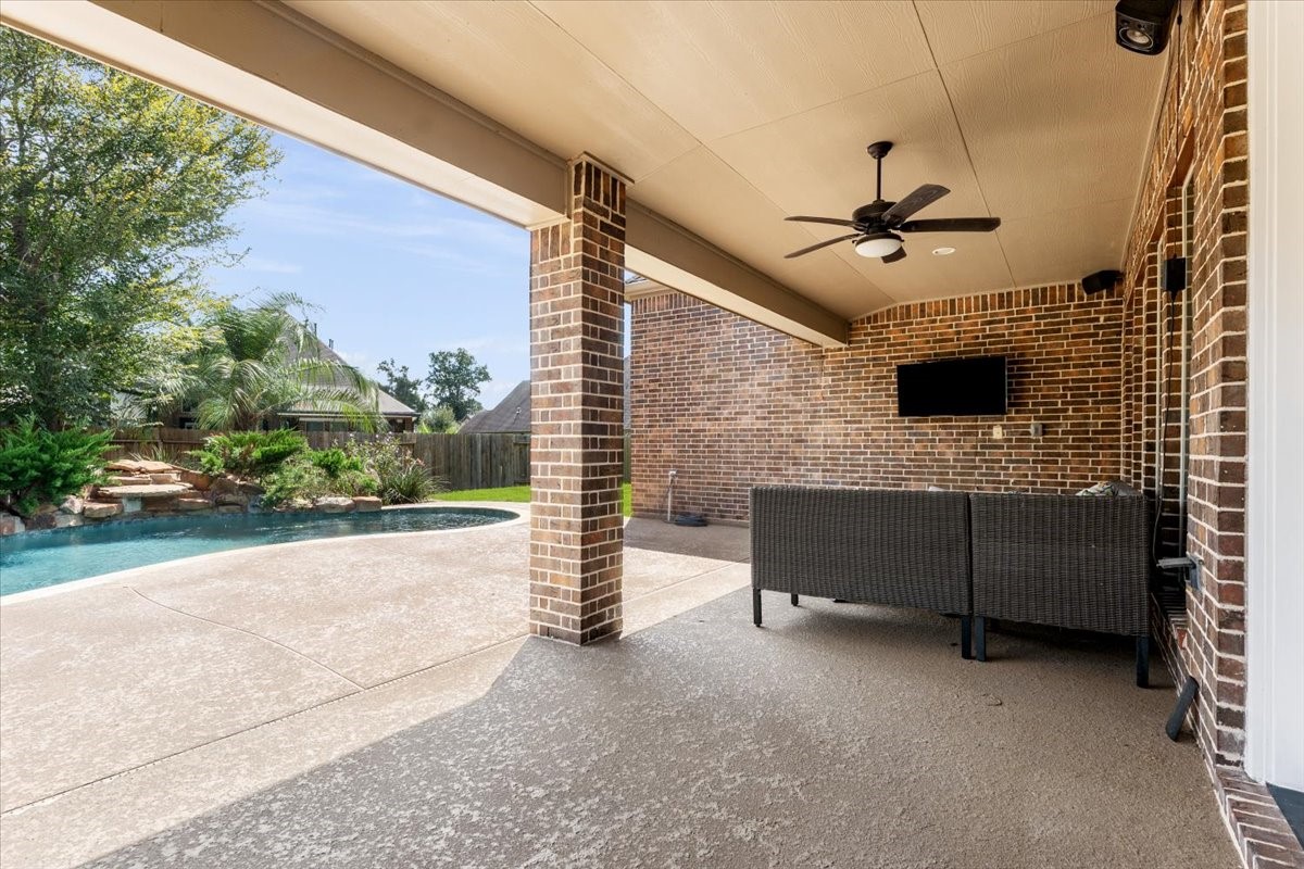 18843 Collins View Drive New Caney, TX 77357 - Photo 39 of 50 Step outside to the covered porch that can easily turn into a screened in porch