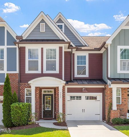 a front view of a house with yard and garage