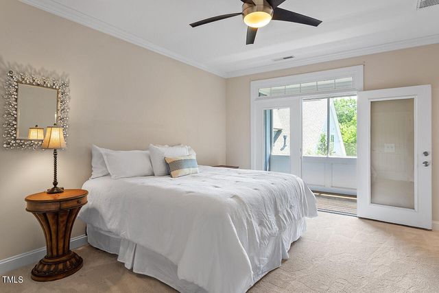 a bedroom with a bed and a table