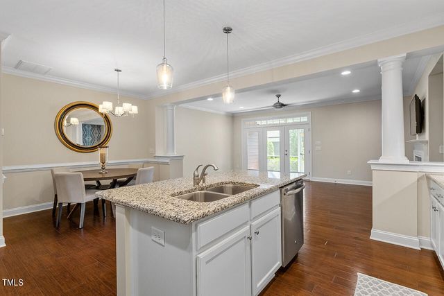 a kitchen with a sink cabinets and window