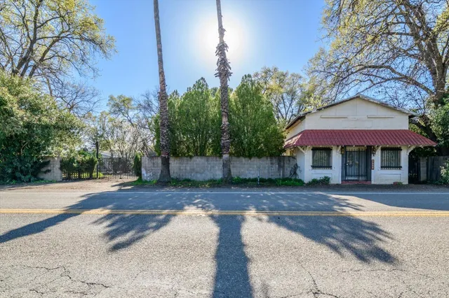 a front view of a house with garden