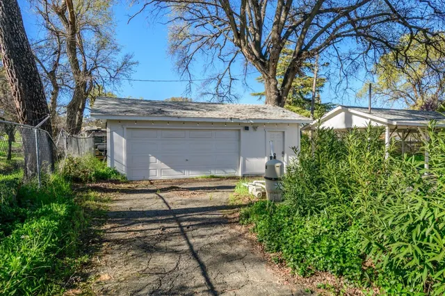 a pathway of a house with a yard