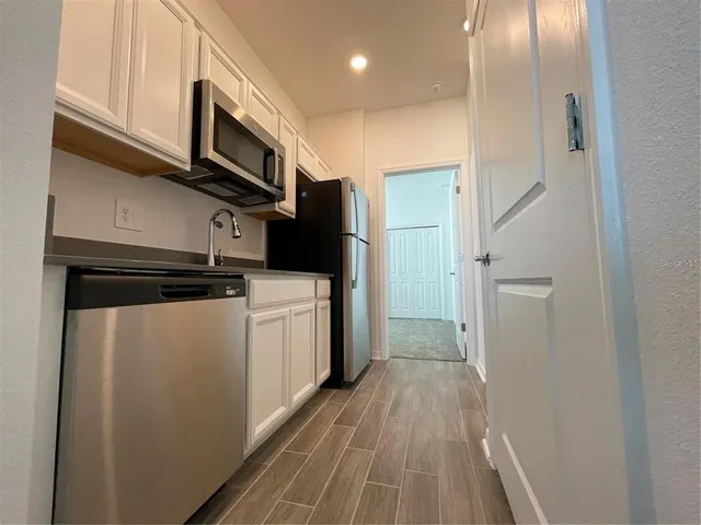 a bathroom with a toilet sink and shower