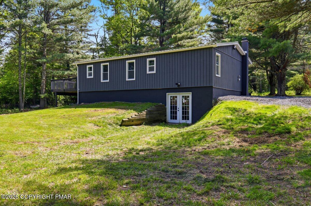 155 Blooming Grove Road Hawley, PA 18428 - Photo 4 of 41 a house is sitting in middle of the garden