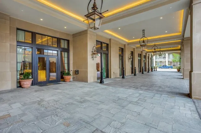 a room with table chairs and entryway