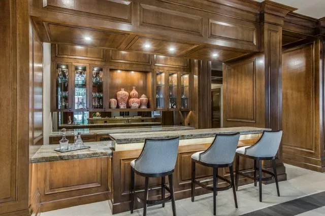 a living room with fireplace furniture and a chandelier