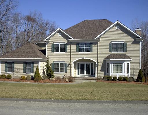 19 Encampment Place Ridgefield, CT 06877 - Photo 1 of 1 a front view of a house with garden