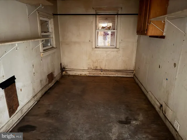 a view of a storage & utility room with a sink