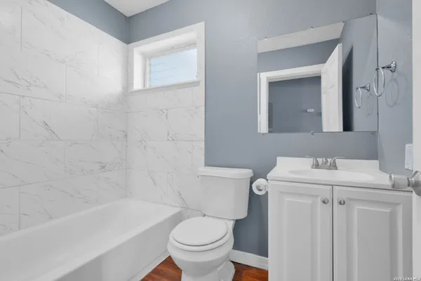 a bathroom with a sink toilet and bathtub