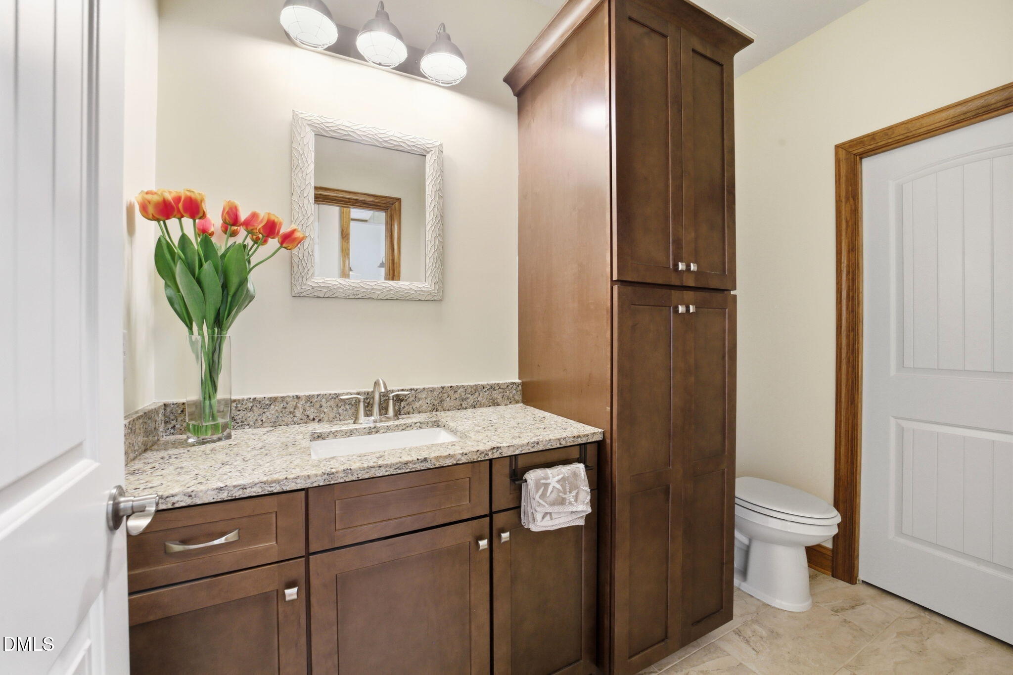 35 North Rippling Court Smithfield, NC 27577 - Photo 40 of 59 a bathroom with a granite countertop sink a toilet and a mirror